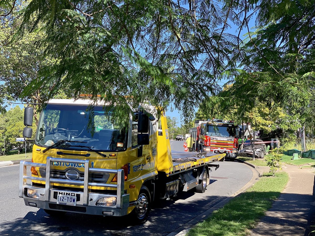 Hino tilt tray truck on the road