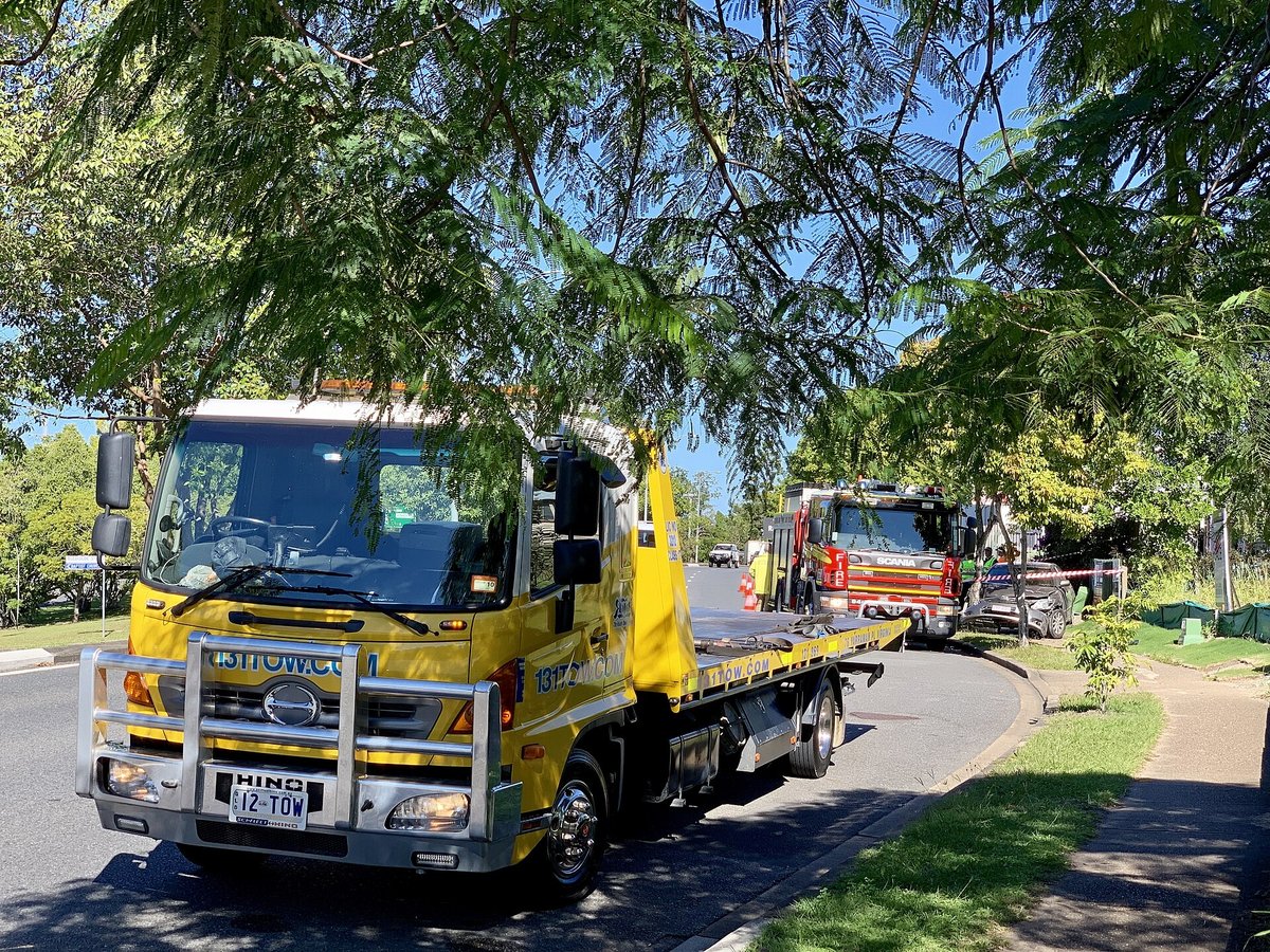 Tow truck and fire truck attending to a single-vehicle accident Fairfield, Queensland, 2019